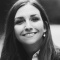 black and white photo of a woman smiling. 